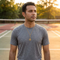Thumbnail for Badminton Racket Necklace Gold – worn by a man playing badminton | Brother & Sisters | SKU: Gold