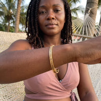 Thumbnail for Be Gorgeous, Be Yourself bracelet in gold worn during a relaxed moment | SKU: bgby-g