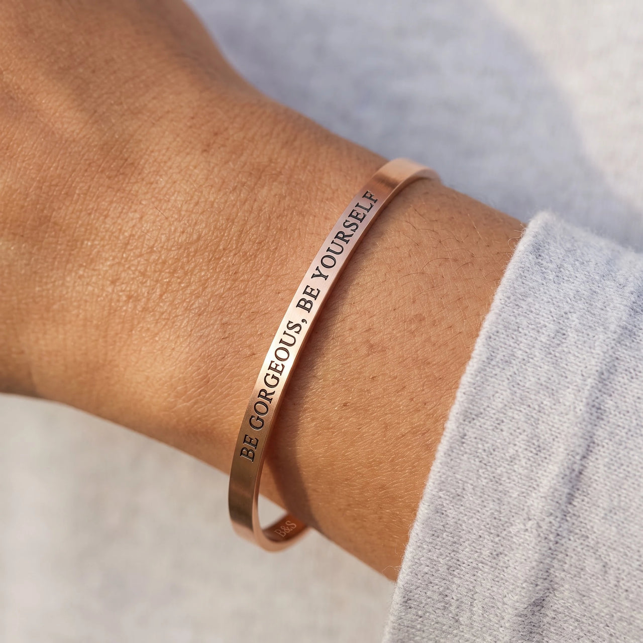 Close-up of the Be Gorgeous, Be Yourself bracelet in rose gold worn | SKU: bgby-rg