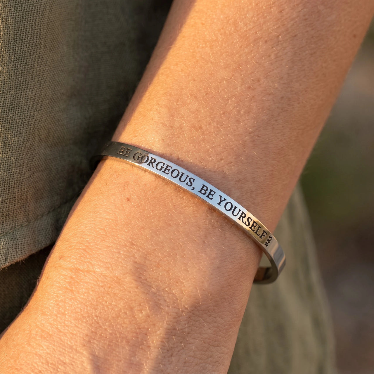 Close-up of the Be Gorgeous, Be Yourself bracelet in silver worn | SKU: bgby-wg