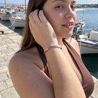 Thumbnail for Woman gently touching her Be Gorgeous, Be Yourself bracelet in silver | SKU: bgby-wg