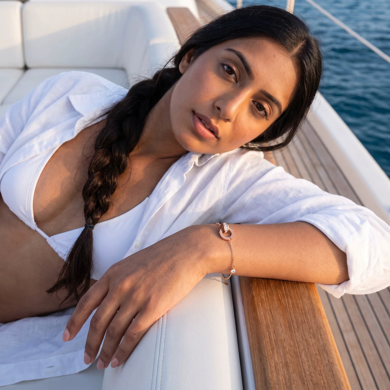 Woman on a yacht wearing the rose gold bracelet | SKU: 25535338-rose-gold