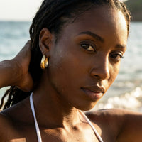 Thumbnail for Chunky Dome Hoops in Gold, worn in the sea, wet skin | SKU: 41005-gold