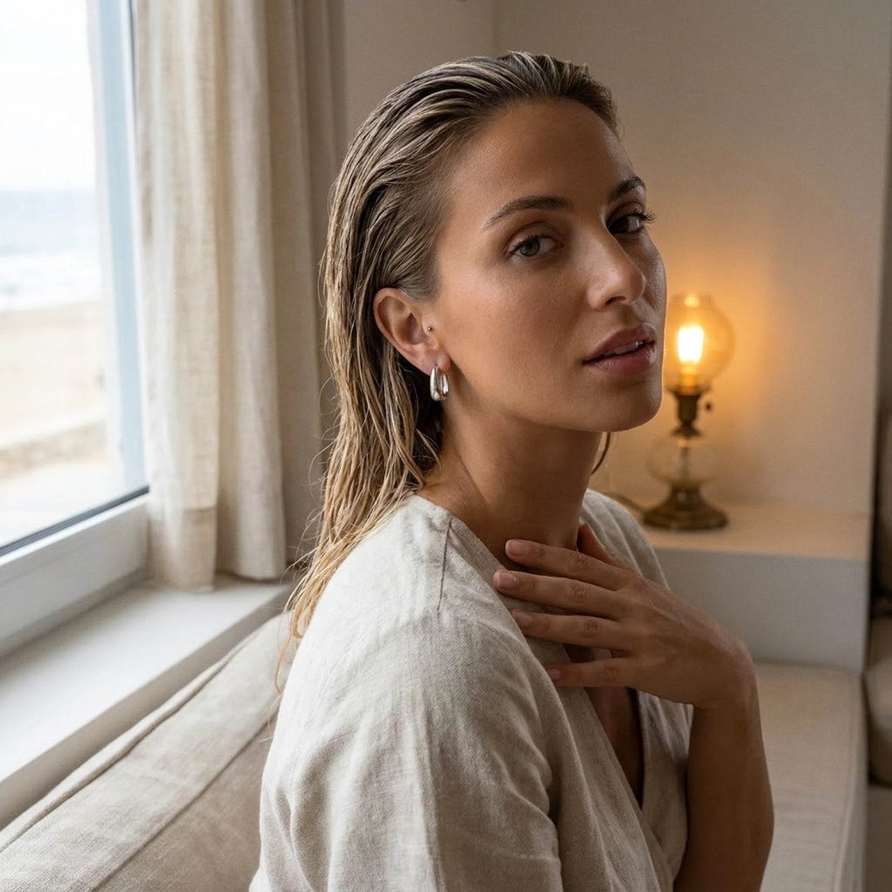 Chunky Dome Hoops in Silver, worn by a window | SKU: 41005-silver