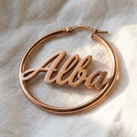 Thumbnail for Custom Name Hoop Earrings in Rose Gold, macro detail of the metal and the finish | SKU: name-hoop-rose-gold-30-mm