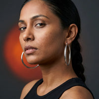 Thumbnail for Diamond Cut Statement Hoops in Silver, studio portrait | SKU: 41009-silver
