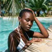 Thumbnail for Diamond Cut Statement Hoops in Silver, worn by a tropical pool | SKU: 41009-silver