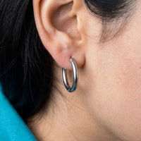 Thumbnail for Everyday Waterproof Hoops in Silver, close-up on the earlobe | SKU: 41001-silver