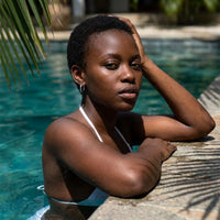 Thumbnail for Everyday Waterproof Hoops in Silver, worn by a tropical pool | SKU: 41001-silver