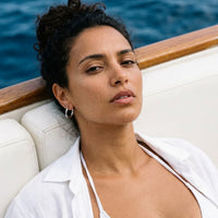 Thumbnail for Everyday Waterproof Hoops in Silver, worn on a yacht | SKU: 41001-silver