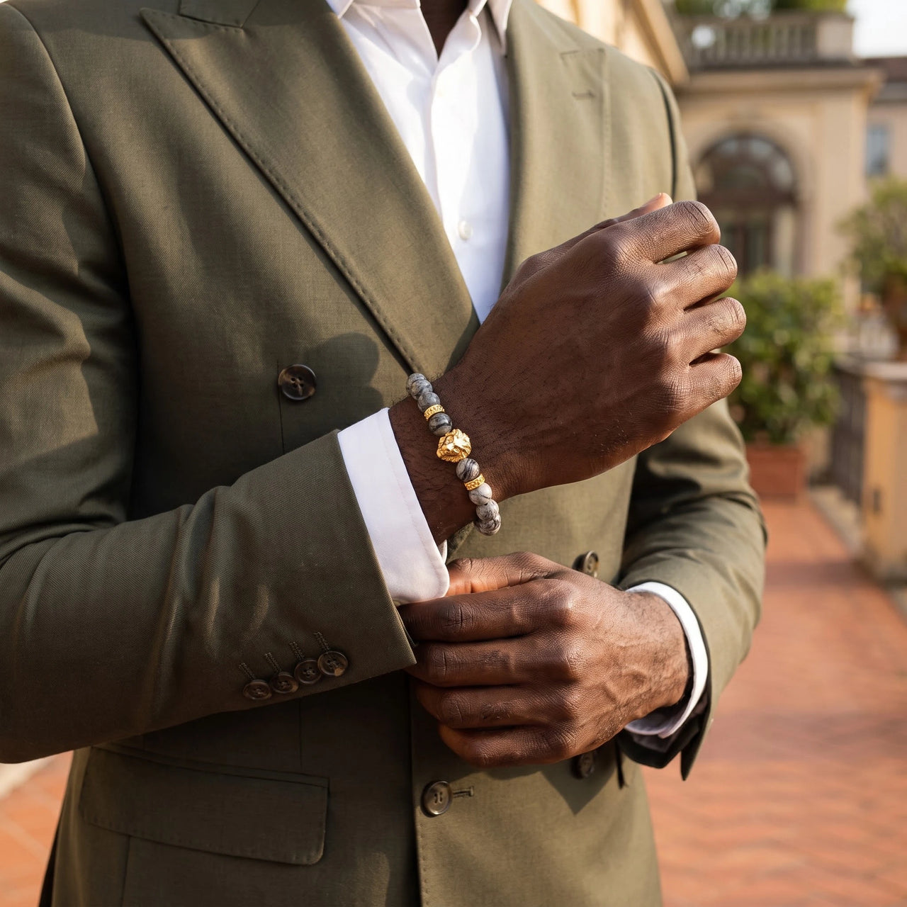 Gold Lion & Grey Stones Bracelet – worn with a shirt cuff | Brother & Sisters | SKU: 20866222-gold-XS-14-15, 20866222-gold-S-16-17, 20866222-gold-M-18-19, 20866222-gold-L-20-21, 20866222-gold-XL-22-23