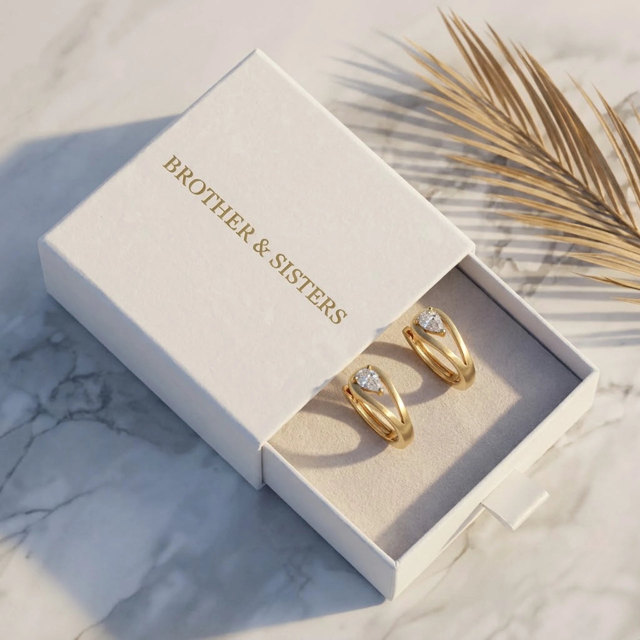 Pear Crystal Huggie Hoops in Gold, in the gift box | SKU: 41007-gold