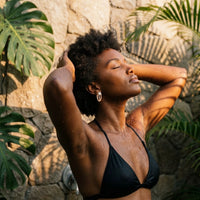 Thumbnail for Pear Crystal Huggie Hoops in Gold, worn in a tropical outdoor shower | SKU: 41007-gold