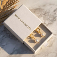 Thumbnail for Pearl Drop Huggie Hoops in Gold, in the gift box | SKU: 41003-gold