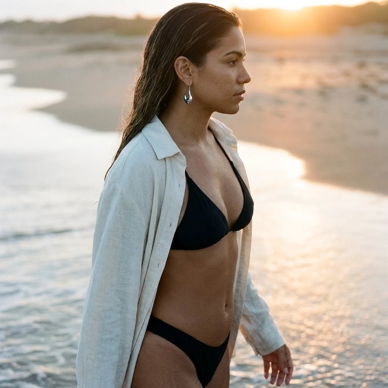 Sculpted Crescent Drops in Silver, worn on the beach | SKU: 41008-silver