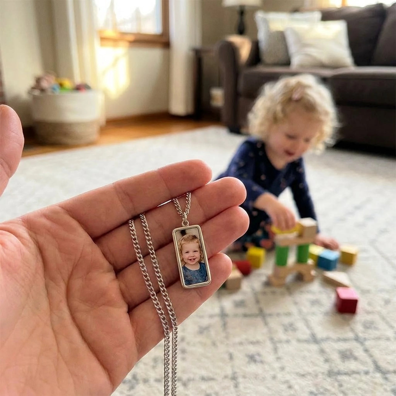 Customer photo: the silver bar necklace with her daughter's photo, her daughter in the background | SKU: TPH-BARN-SILVER