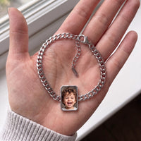 Thumbnail for The silver cushion-cut photo bracelet in her palm, showing the lobster clasp and extension chain, with a little boy's photo | SKU: TPH-CUSB-SILVER