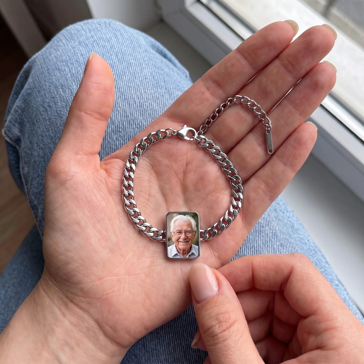 The silver cushion-cut photo bracelet in her palm, a fingertip warming the charm to reveal her grandfather's photo | SKU: TPH-CUSB-SILVER