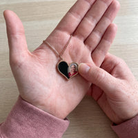 Thumbnail for Thumb warming the rose gold heart pendant: the hidden photo appears under the thumb while the rest stays black | SKU: TPH-HRTN-ROSEGOLD