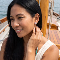 Thumbnail for Woman relaxing on holiday wearing the silver stud earrings | SKU: 505185-white