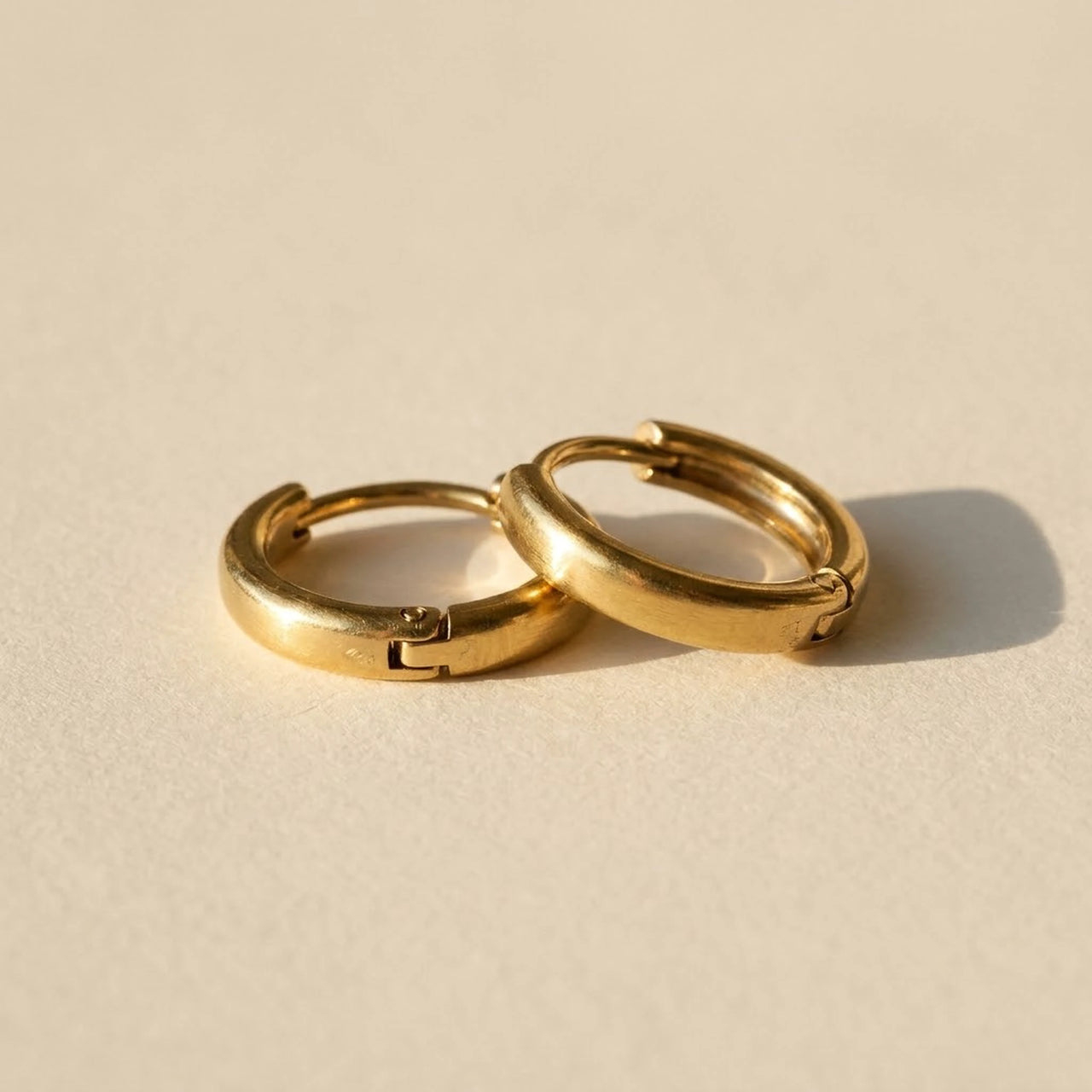 Tiny Huggie Hoops in Gold, product photo | SKU: 41002-gold