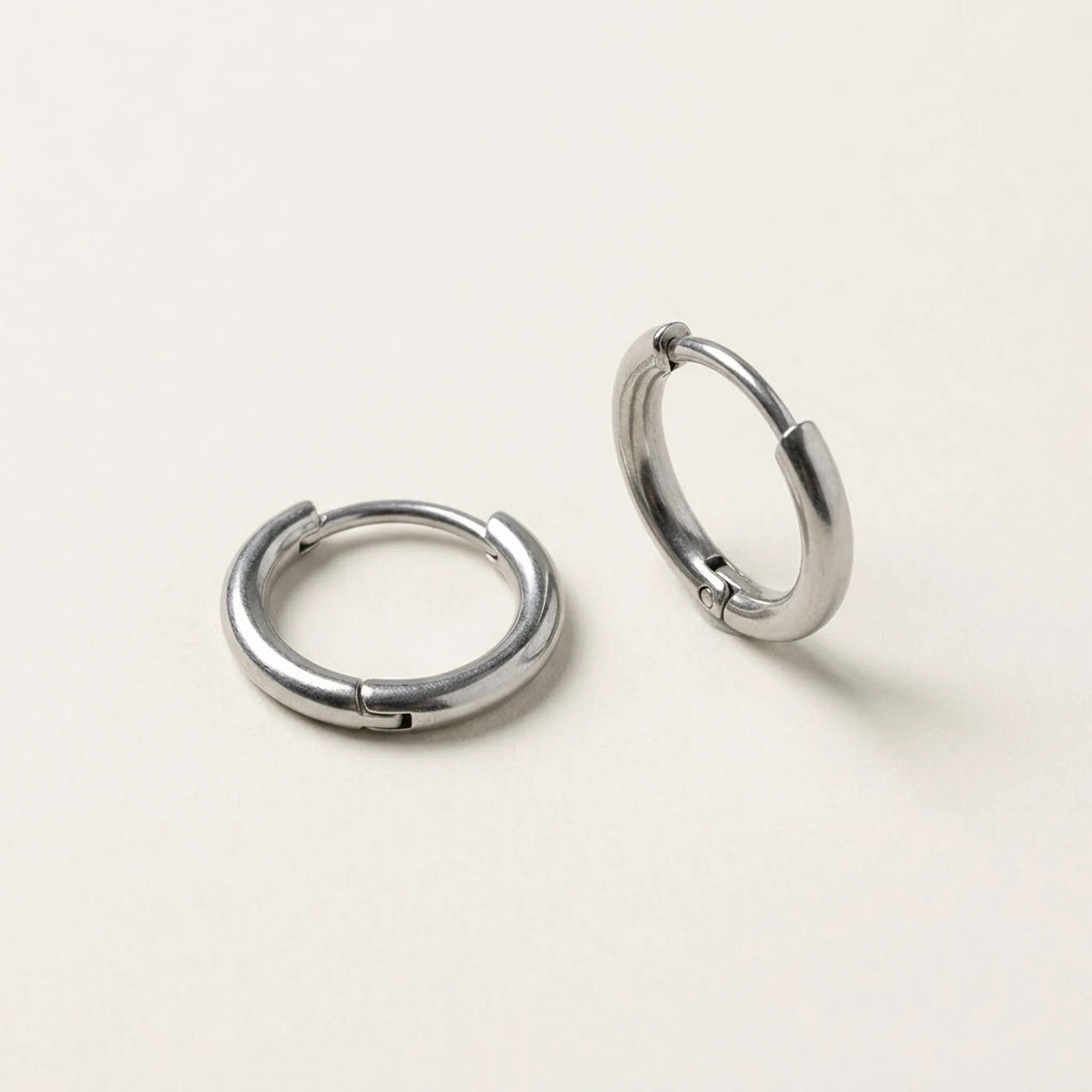 Tiny Huggie Hoops in Silver, product photo | SKU: 41002-silver