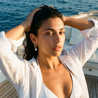 Thumbnail for Twisted Pearl Drop Hoops in Gold, worn on a yacht | SKU: 41004-gold